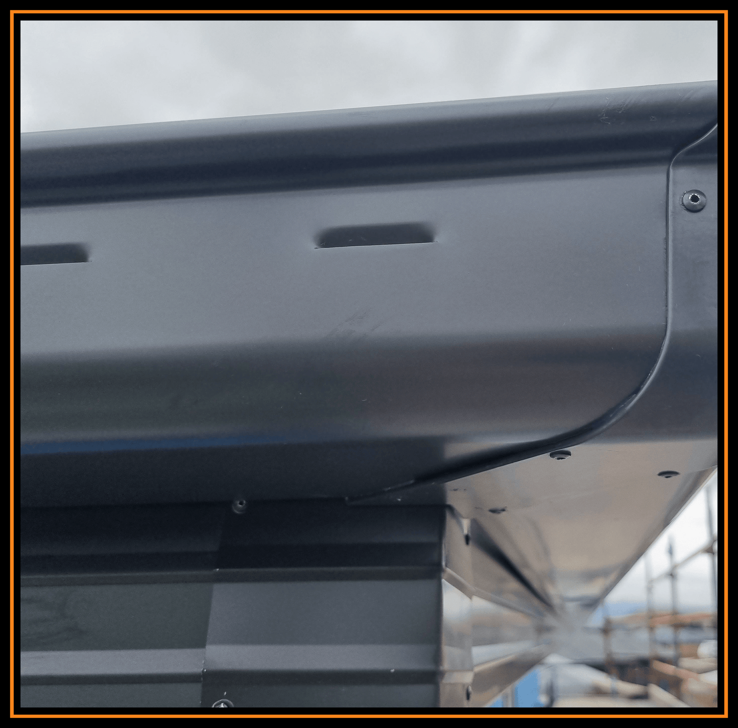 This is an image of some Slotted Quad Gutter that has been installed on a job. The colour is called Monument and it is made from Colorbond Steel